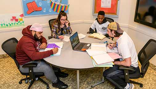 Students studying at a table